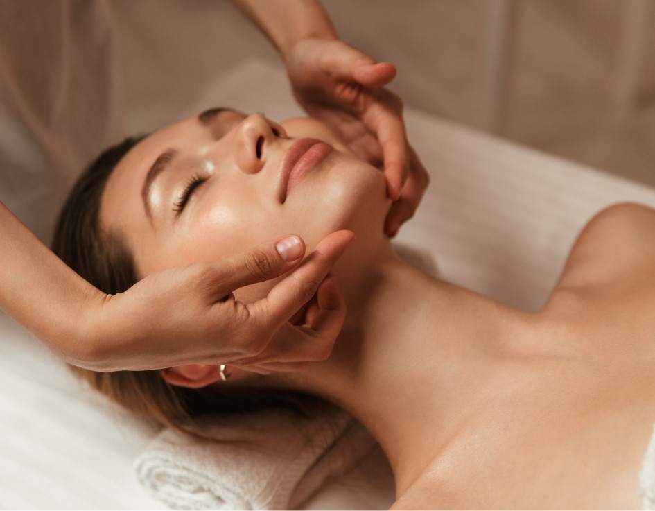 A lady getting a face massage at Silver Sixpence Spa Wanaka