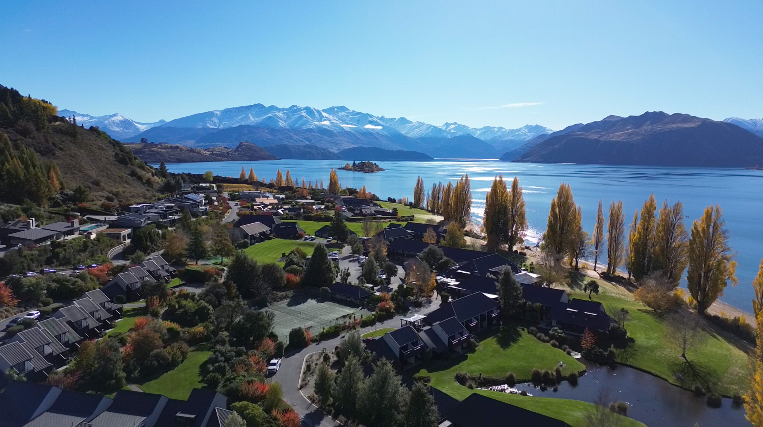 Edgewater aerial view with snow and right on the lake edge