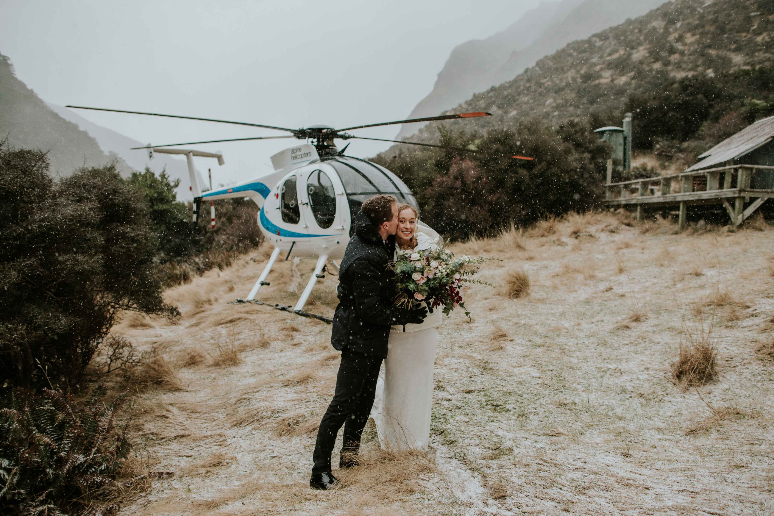 A couple enjoying their mountain wedding photoshoot
