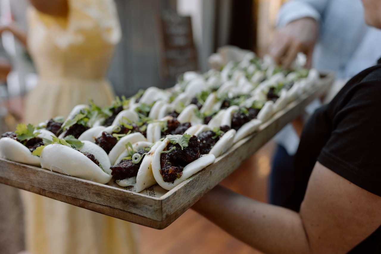 a platter of Bao Buns that are included in Edgewater's wedding packages